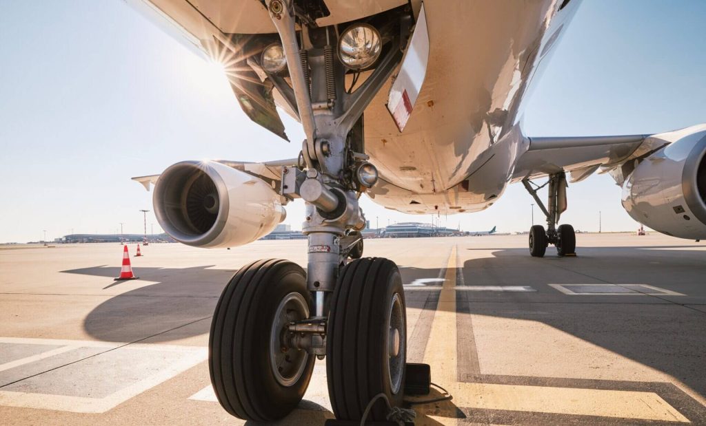 Cargo aircraft being loaded on a tarmac, representing the dangerous goods air transport rules discussed in HSC's free ICAO Dangerous Goods Panel webinar on September 8, 2026