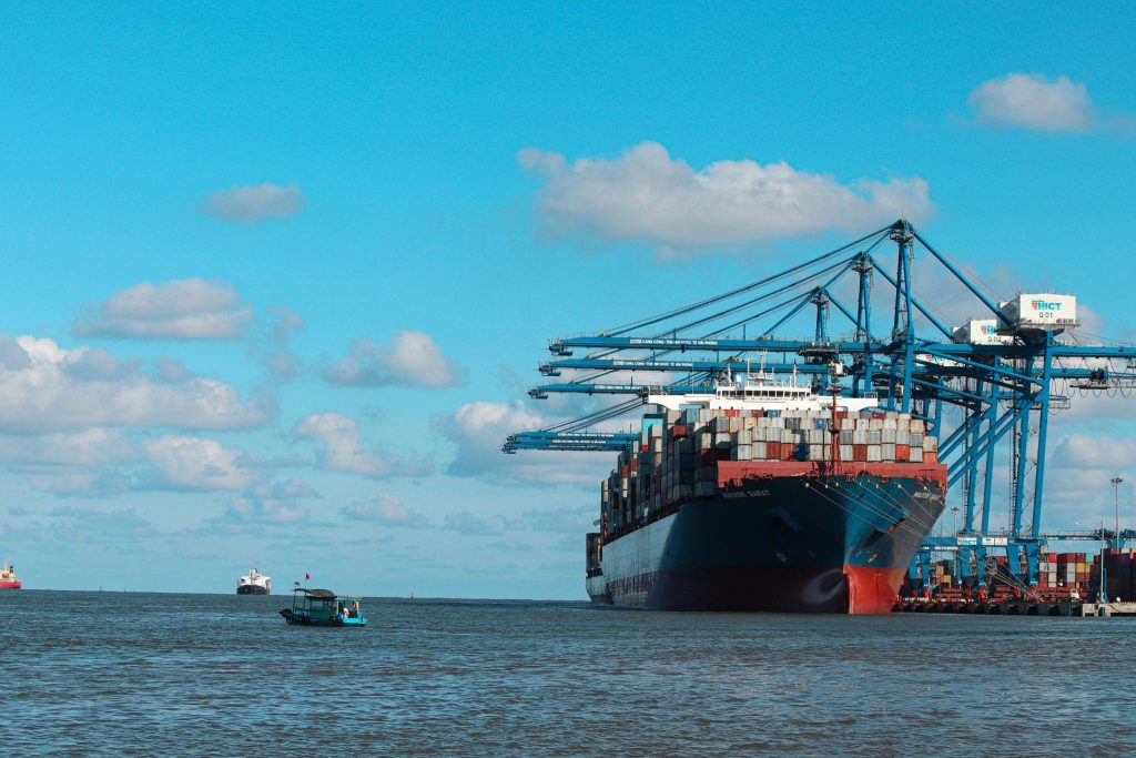 Rows of vehicles loaded aboard a roll-on/roll-off cargo vessel, illustrating the scale of risk that enterprise-wide lithium battery safety programs are engineered to prevent.